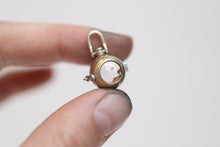 Load image into Gallery viewer, Petroleum Included Quartz Orb Locket
